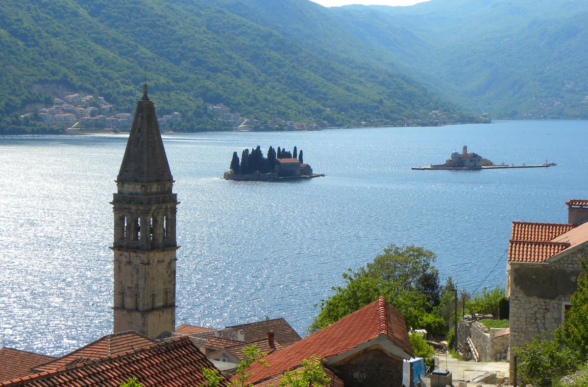 Views of the two man-made islands of Abbey of St. George (left) and Our Lady of the Rock (right). The stunning beauty of Kotor Bay in Perast, Montenegro