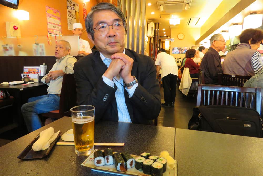 eating sushi in Tokyo. How to see Tokyo with a Free Volunteer Guide