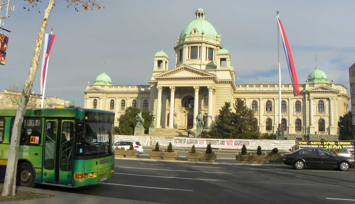 Signs in front of the Serbian Parliament building