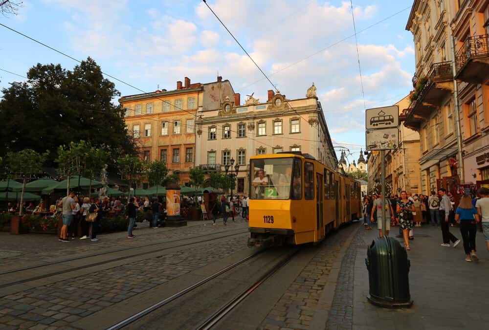 tram cutting through the busy Rynok in Lviv