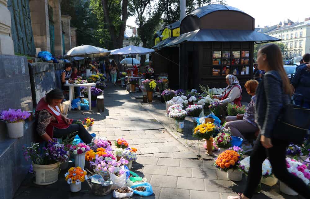 ladies selling flowers at the market in Lviv. Why we loved our Summer in Lviv (in photos)