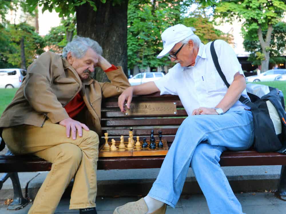 men playing chess on park bench in Lviv. Why we loved our Summer in Lviv 